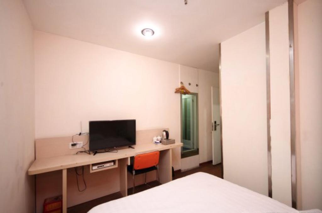 Yixin Business Hotel Гуанчжоу Экстерьер фото